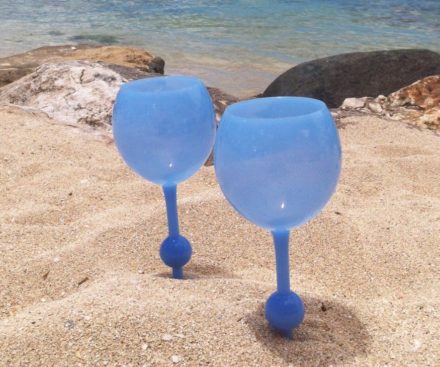 Beach wine glass spiked in sand